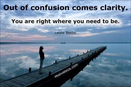 person standing on a long dock and an inspiring quote: Out of confusion comes clarity. You are right where you need to be.