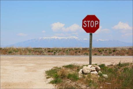 stop sign on a desert road
