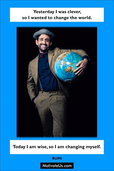 man holding a world globe