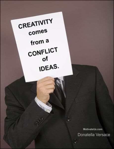 A Picture: (Man Holding A Sign In Front Of His Face with The Quote:  quote1 on it.