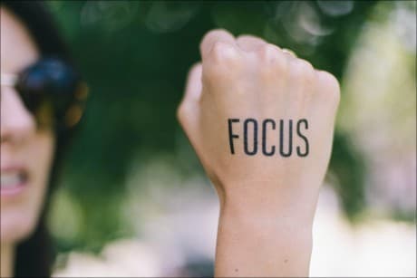 a tattoo that says focus.