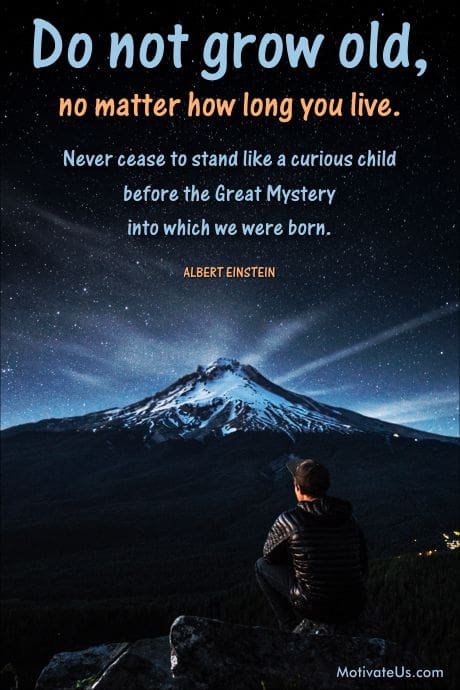 man sitting on a hill, looking at the stars with a quote by Albert Einstein