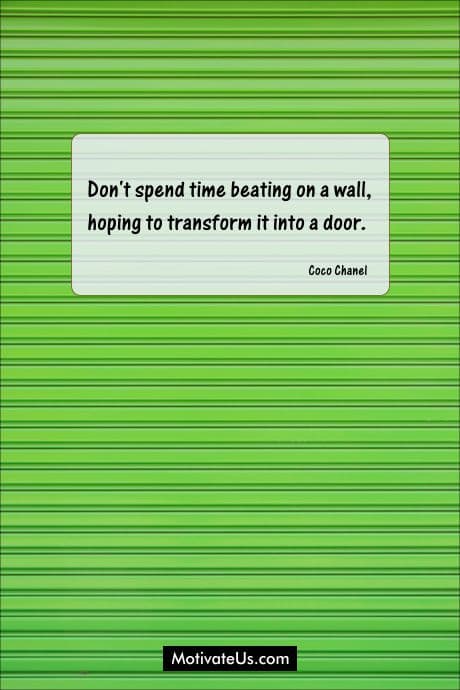 green wall with a quote by Coco Chanel