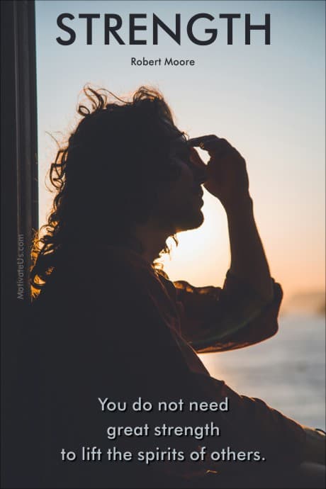 person holding her head in the shadows