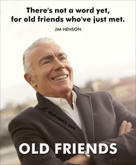 man smiling with arms crossed