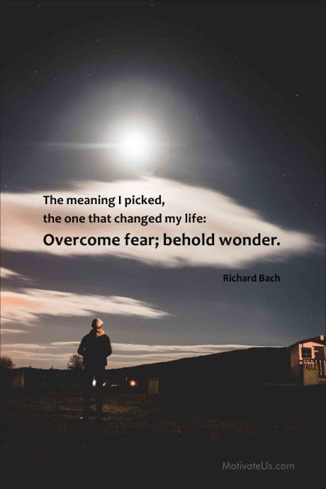 person looking up to the sky and seeing a quotation by Richard Bach on overcome fear.