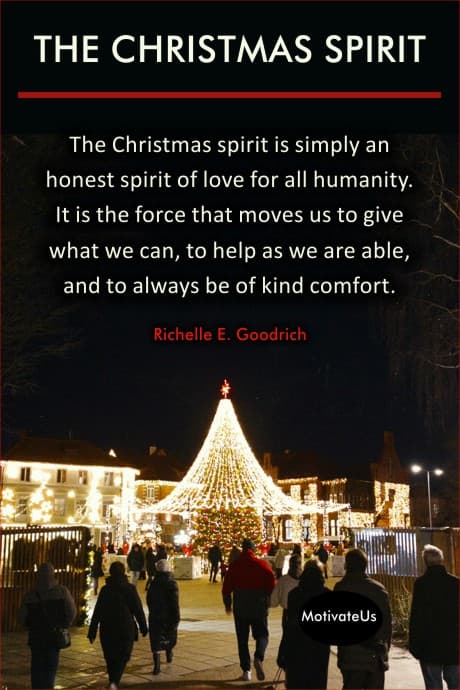 people walking uip to a lighted tree