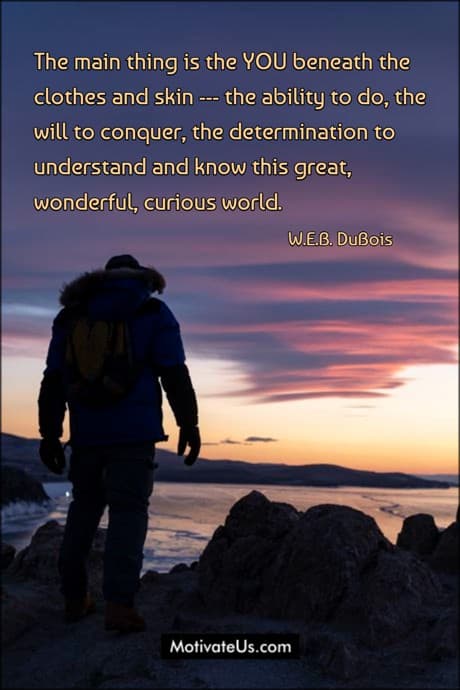 person in a winter jacket looking at sunrise and a quote by W.E.B. DuBois