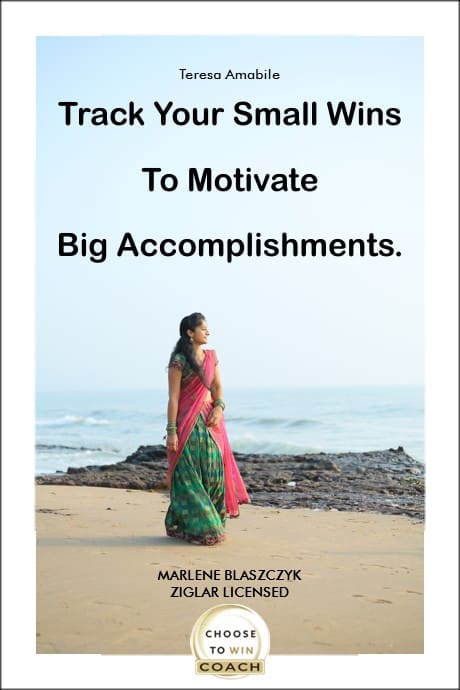 Indian woman looking at the sea with a quote to remind her to Track Your Small Wins To Motivate Big Accomplishments.