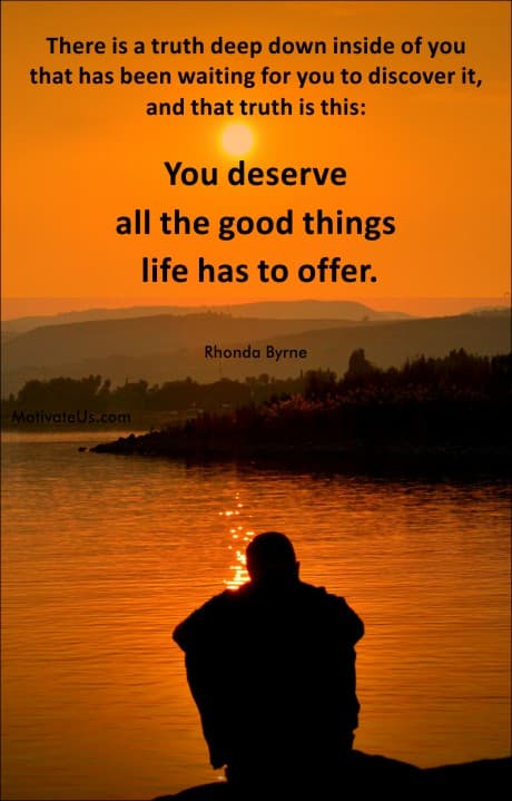 person sitting on the water's edge.