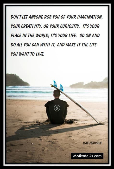 surfer sitting on the beach contemplating his creativity, imagination and curiosity.