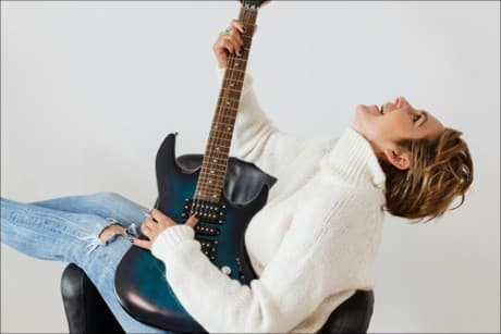 person rocking out on a guitar