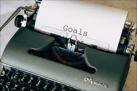 typewriter with the word goals typed on paper