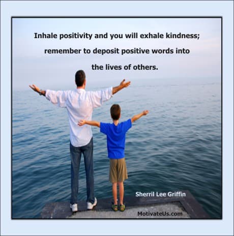 man and boy with hands in the air