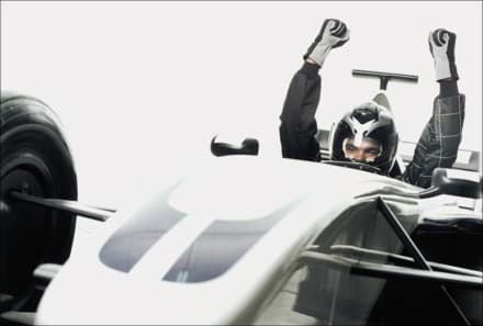 racecar driver hands in the air